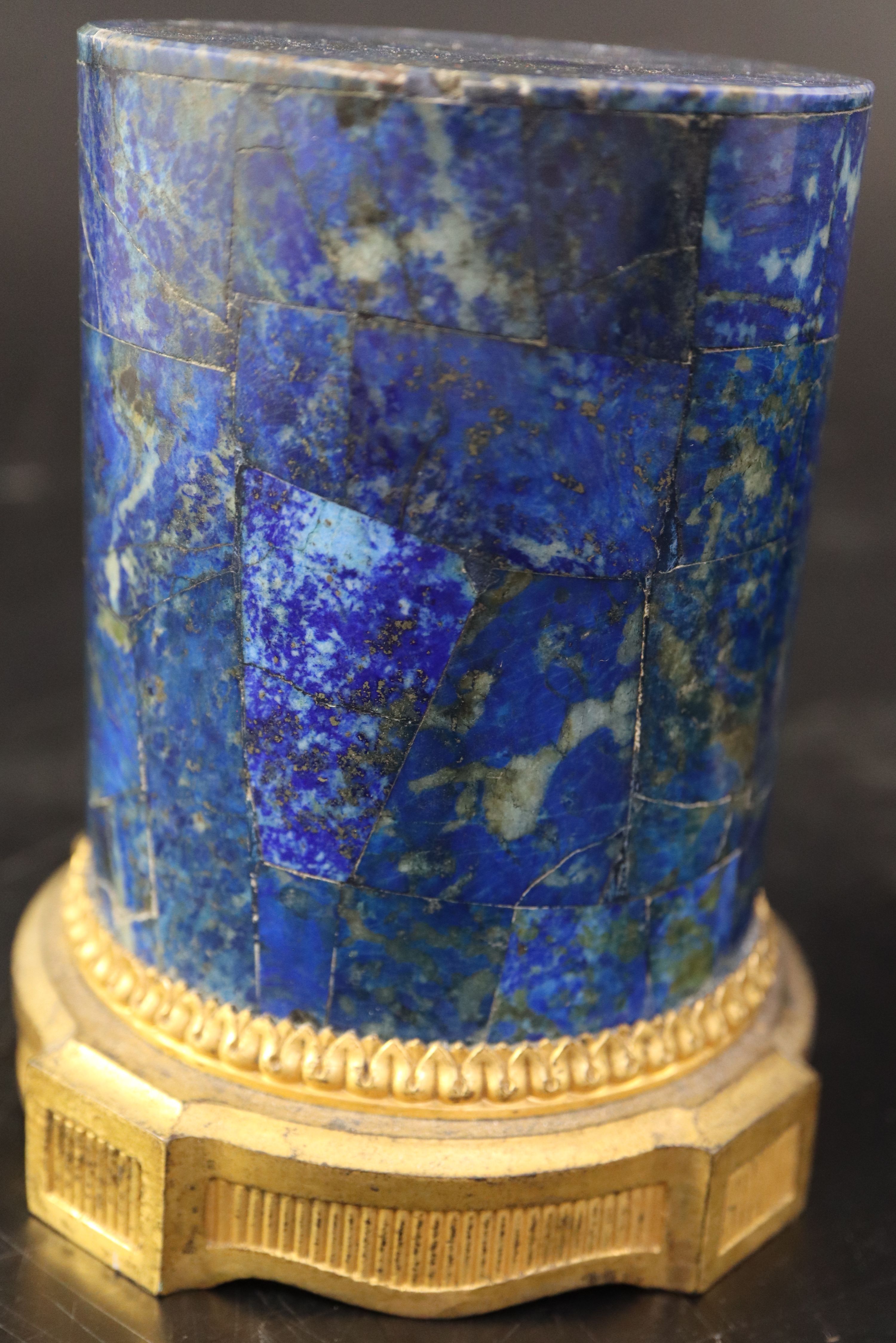 A pair of late 18th century ormolu mounted lapis lazuli socles, diameter 10cm height 12.5cm